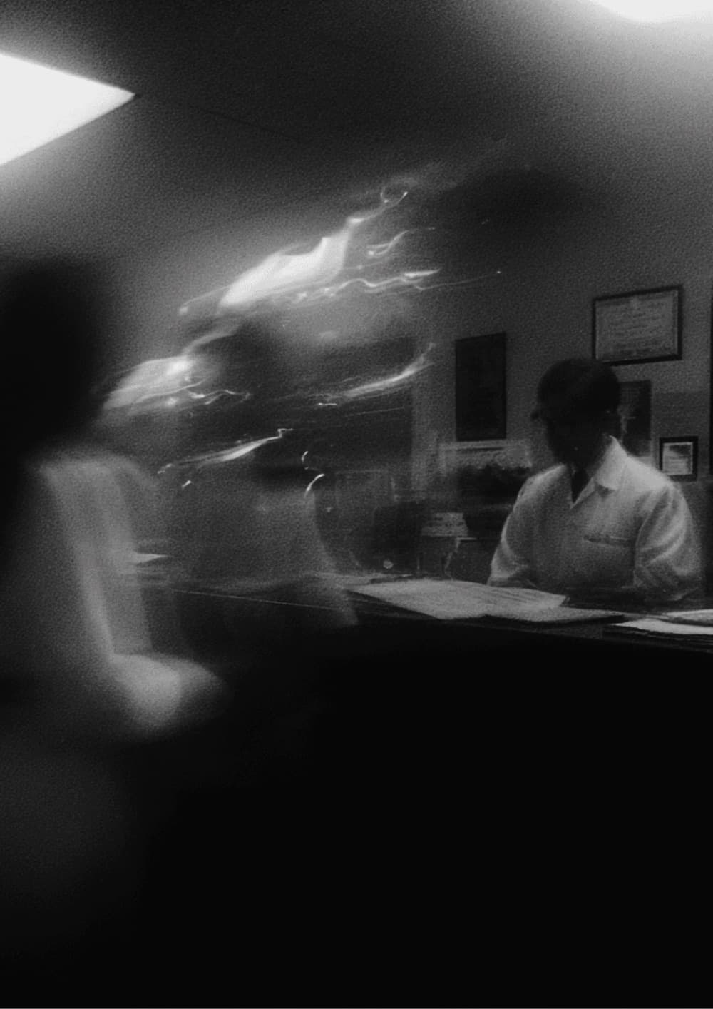 A dental front desk in motion, in black and white